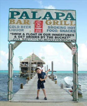 boy on dock in Ambergris Caye – Best Places In The World To Retire – International Living